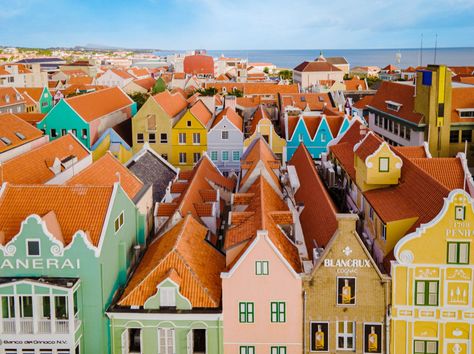 Best Of Willemstad: Things To Do, Restaurants & More | SANDALS Outdoor Stone, Willemstad, Blue Curacao, History Lessons, All Inclusive Resorts, Caribbean Islands, Mambo, Local Artists, Tourist Destinations