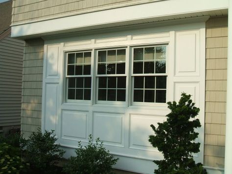 Garage Conversion Exterior Windows, Garage Door To Window Conversion, Renovate Garage, Moulding Around Windows, Carport Renovation, Window Bump Out, Raised Panel Wainscoting, Panel Wainscoting, Awning Over Door