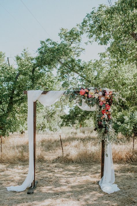 Alter arrangement for boho wedding Arbor Flowers Wedding Outdoor Ceremony, Wooden Ceremony Arch, Garden Party Wedding Arbor, Spring Arbor Wedding, Backyard Wedding Arch Ideas, Wedding Alter Backdrops, Wildflower Wedding Arbor, Wedding Arbour Flowers, Wedding Alter Ideas