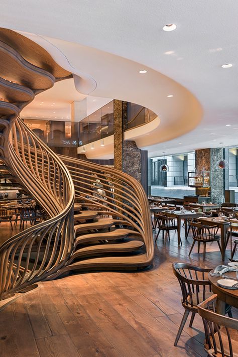 Each of these restaurants offers a unique contemporary interior design that inspires the guests! We, at Brabbu Contract, are impressed by this interior design project, which is inspired by nature. Cafe Stairs Design, Restaurant Stairs Design, Restaurant Staircase Design, Staircase Restaurant, Arch Interior Design Restaurant, Stairs In Restaurant, Restaurant With Mezzanine, Restaurant Design Awards, Modern Room Design