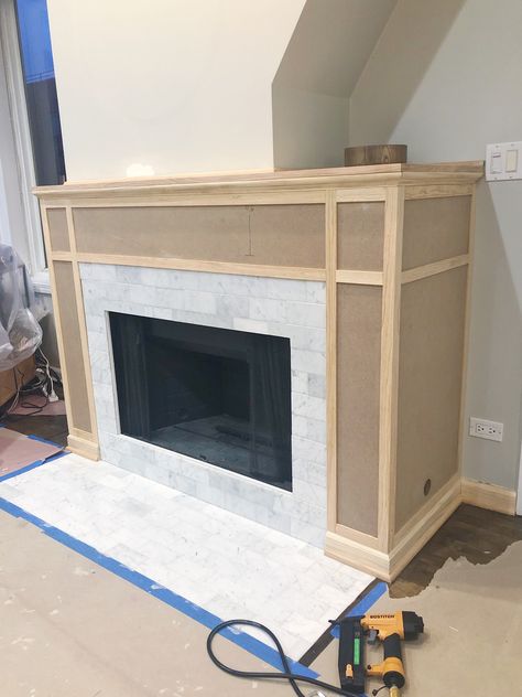 How to build a fireplace mantle and surround with MDF and trim. Come check out this easy tutorial to upgrade your fireplace on a budget! #woodworking #DIY #DIYfireplace #marblefireplace #fireplacemakeover Texas Homestead, Diy Mantle, Diy Fireplace Mantle, Wood Fireplace Surrounds, Diy Fireplace Mantel, Fireplaces Layout, Paint Tile, Fireplace Diy, Simple Fireplace