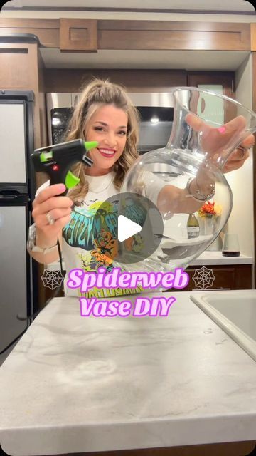 Amanda Jean Gilmore on Instagram: "Transforming my home into a haunted haven with this DIY spiderweb vase that lights up! 🕷️✨ Perfect for adding a touch of spooky elegance to any room. Who says Halloween has to wait until October? 👻🕸️ I got all my supplies at @Dollar Tree  and @Walmart and my shirt is from @Five Below happy#Summerween #DIYMagic #SpookyVibes #LightUpCraft #CreepyDecor #CraftingFun #SpookySeason #HauntedVibes #HalloweenAllYear 🎃 💀 #SpookySeason #DIYCrafts #HauntedHouse #DollarTreeFinds #HalloweenDecor #CraftingFun #GetCrafty #dollartreediy #dollartree #craft #halloweencrafts #diys #happycrafting #dollartreefinds #SpookySeason #dollartree #halloween2024countdown #walmartcrafts" Simple Halloween Centerpieces For Table, Diy Halloween Vase, Dollar Tree Halloween 2024, Halloween Vase Ideas, Diy Halloween Decorations For Inside Home Decor, Dollar Tree Halloween Diy 2024, Dollartree Halloween Decor Diy, Halloween Vases Diy, Halloween Dollar Tree Crafts