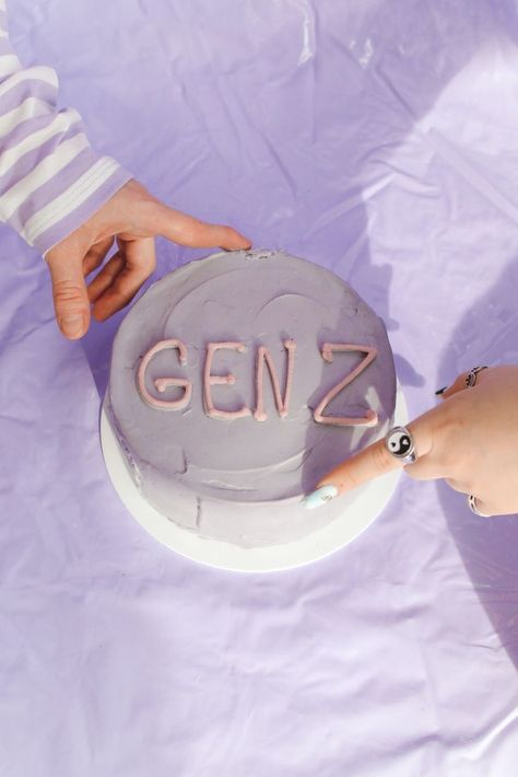 lavender purple violet gen z cake with yin and yang ring and people pointing hands to the cake. #generationz International Youth Day, Well Pictures, Purple Cakes, Millennials Generation, Generation Z, Personal Injury, Gen Z, Influencer Marketing, Beauty Industry