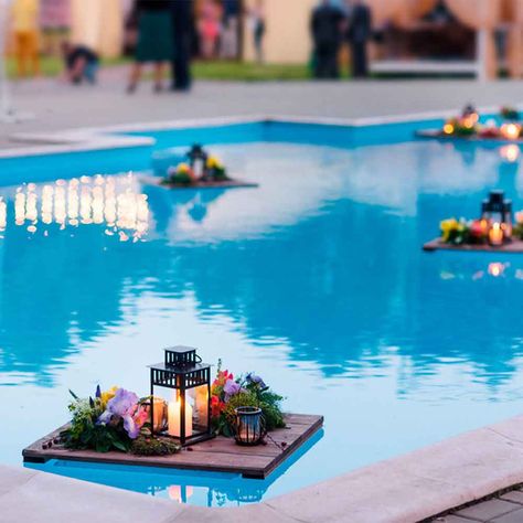 If you're lucky enough to enjoy a pool or water feature in your outdoor space, add an element of surprise to your next gathering with floating lights. Store-bought, toss-in options are a quick and easy way to add glam, but for a truly remarkable effect, flex your woodworking muscle and build custom mini-pallets like those pictured. You can deck them out with candles, flowers, or anything else your party requires. If you love the idea, but don't have a water feature (yet) check out how to buil... Pool Wedding Decorations, Candles And Flowers, Pool Wedding, Pool Party Decorations, Floating Lights, Diy Outdoor Decor, Floating Flowers, Pool Decor, Floating Candles