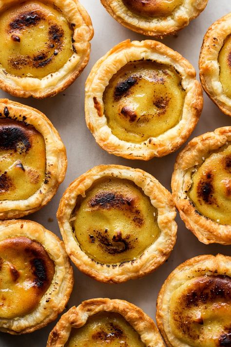 Vegan Portuguese custard tarts - Lazy Cat Kitchen Food In Portugal, Portuguese Custard Tarts, Vegan Pastry, Pastry Puff, Lazy Cat Kitchen, Custard Tarts, Vegan Pastries, Cat Kitchen, Vegan Pie