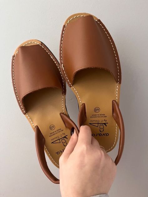 Get back to basics with our timeless brown sandals. Versatile and chic, these sandals are the perfect everyday footwear. Whether you're running errands or going for a casual stroll, these sandals will keep you comfortable and stylish all day long. #sandalsforwomen #zapatosmujer #shinysandals #leathersandals #spain #hendmadeshoes #sandels #summeroutfit #leathershoes #zapatosdemoda Brown Casual Shoes, Spanish Shoes, Menorca Spain, Fancy Shoes, Leather Platform Sandals, Leather Sandals Flat, Leather Sandals Women, Brown Colour, Comfortable Heels