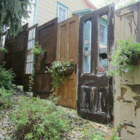 Repurposing cast-off doors.  Ideas from Dishfunctional Designs' blog  (scroll down) past her jewelry ideas. Salvaged Doors, Deco Champetre, Doors Repurposed, Plants Growing, Vintage Doors, Backyard Fences, Privacy Fence, Wooden Fence, Garden Gate