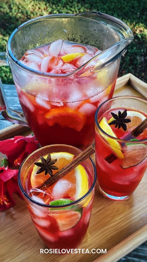 How to make this deliciously pretty iced, spiced and spiked hibiscus iced tea! Iced Hibiscus Tea, Hibiscus Tea Recipe, Hibiscus Iced Tea, Herbal Tea Benefits, Dried Hibiscus Flowers, Tea Drink Recipes, Tea Stained Paper, Iced Tea Recipes, Tea Cocktails