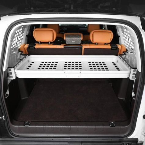 Tired of trunk chaos? Meet the Aluminum Alloy Trunk Storage Rack—your SUV's new best friend! Crafted from durable, high-grade aluminum, it maximizes space, keeps essentials within easy reach, and adds a sleek touch to your vehicle’s interior. No tools needed for setup, just effortless organization and style. Whether you're hitting the road or just staying tidy, this rack's got you covered. Elevate your trunk game today! Suv Back Organization, Trunk Storage Ideas Suv, Suv Organization, Suv Organization Trunks, Car Trunk Organizer Cute, Suv Trunk Organization, Suv Storage, Trunk Storage, Car Trunk Organization