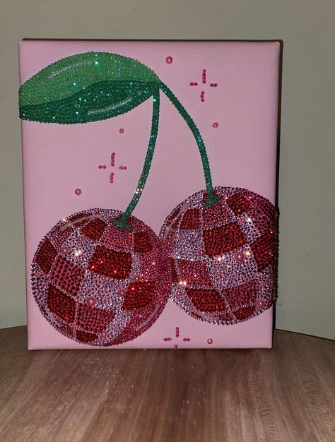 Introducing a dazzling piece of art: the Cherry Disco Ball Handmade canvas. Each rhinestone is meticulously placed by hand, creating a stunning visual effect. This 8x10 canvas is ready to mount and adds a touch of sparkle to any space. Crafted to order, please allow 1-2 weeks for this unique creation to arrive at your doorstep. Canvas Room Paintings, Cool Paintings For Bedroom, Canvas Bead Art, Bedazzled Canvas Painting, Vibe Painting Ideas, Bedazzled Canvas Ideas, Dorm Room Canvas Painting Ideas, Bling Canvas Art, Canvas Rhinestone Art