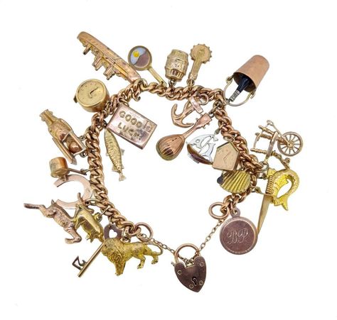 Lot - A 9ct gold charm bracelet with assorted charms, Dog Charm Bracelet, Jet Privé, Auction Catalog, Vintage Sterling Silver Charms, Royal Guard, The Guard, Sterling Silver Charm Bracelet, Gold Charms, Bracelet Charms