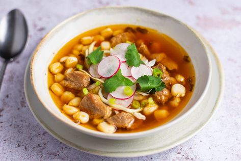 Posole, also known as pozole, is a simple stew made with pork and hominy. This posole rojo recipe uses red chile peppers and is easy and delicious. Food Ideas Mexican, Pozole Rojo Recipe, Freezing Cilantro, Mexican Pozole, Crock Pot Roast, Pozole Recipe, Chile Peppers, Mexican Soup, Dried Peppers