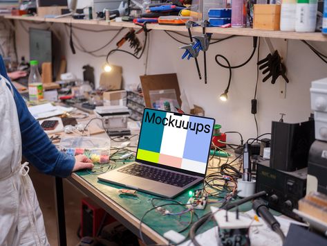 This mockup features a MacBook Pro in a workshop setting, placed on a cluttered workbench. The bench is scattered with tools, wires, and electronic components, creating an atmosphere of busy productivity. A person in a blue shirt and apron is visible, interacting with small components nearby. Use this mockup to display your app or project in a realistic, hands-on environment. 

#UI #UX #Mockup #MacBookPro #Workshop #Productivity Computer Mockup, Landing Page Inspiration, Electronics Workshop, Macbook Mockup, Billboard Mockup, Podcast Studio, Ipad Mockup, Hobby Electronics, Crafts Workshop