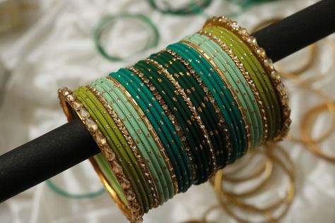 Follow us on Instagram- @studio_kalai Bangle Setting Ideas, Luxury Green Bangle, Bangles Setting Ideas, Bangles Combination, Green Bangles Set, Green Pallet, Green Bangles, Aesthetic Jewellery, Wedding Jewelry Sets Bridal Jewellery