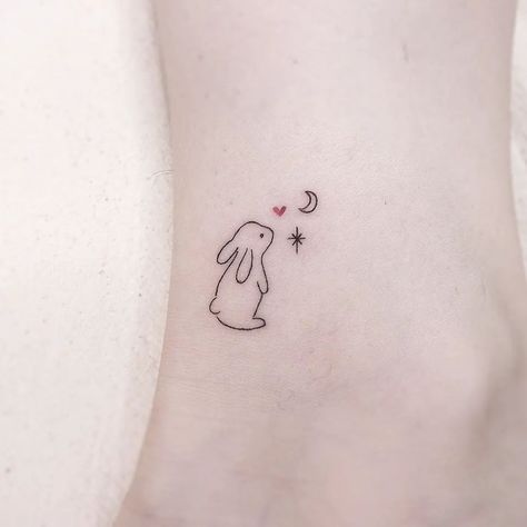 20  Enchanting Mini Rabbit Tattoo Designs for Your Inspiration - WomenSew Outline Bunny Tattoo, Rabbit Hand Tattoo, Bunny Stamp Tattoo, Bunny Matching Tattoo, Mini Bunny Tattoo, Bunny Line Tattoo, Dainty Bunny Tattoo, Fine Line Rabbit Tattoo, Baby Bunny Tattoo