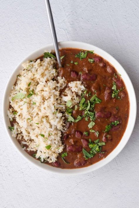 This Vegan Red Beans and Rice recipe is a healthy version of the traditional Louisiana dish. It's quick to prep, and most of the cooking time is hand-off. I make this weekly as part of my meal prep. Refrigerate for 5 days, or freeze. Stovetop and Instant Pot directions below. Sweet Potato And Chickpeas, Protein Entrees, Vegan Red Beans And Rice, Vegan Red Beans, Red Beans And Rice Recipe Crockpot, Veggie Roast, Vegan Bean Recipes, Red Beans Recipe, Maple Dressing