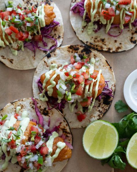 Baja Fish Tacos are beer battered and fried until crispy. Place them in a warm tortilla with a cabbage slaw, avocado crema and pico de gallo. Authentic Fish Tacos, Fish Tacos Cod, Seafood Extravaganza, Birria Tacos Recipe, Fish Taco Recipe, Battered Fish Tacos, Baja Fish Tacos, Fish Friday, Spanish Foods