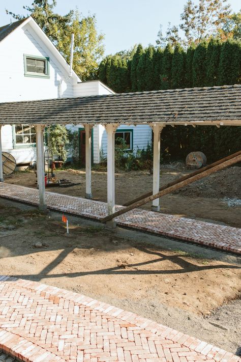 Exterior Update: Our Herringbone Brick Patio Is *Almost* Installed - Emily Henderson Herringbone Brick Patio, Brick Installation, Front Portico, Herringbone Brick, Brick Border, Chickens In The Winter, Brick Paver Patio, Brick Patio, Fire Pit Area