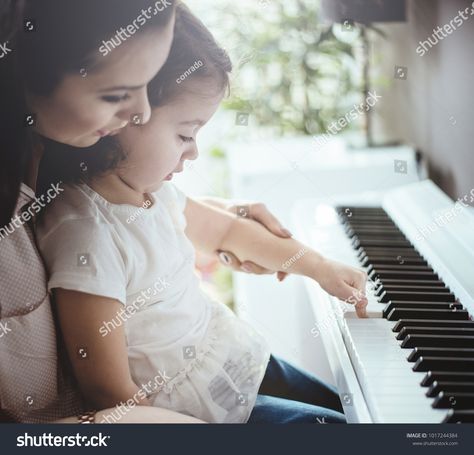 Beautiful young mother with her daughter together, learning playing musical instrument #Ad , #affiliate, #mother#daughter#Beautiful#young Piano Playing, Play To Learn, Model Release, Musical Instrument, Royalty Free Photos, New Pictures, Mother Daughter, Piano, Photo Editing