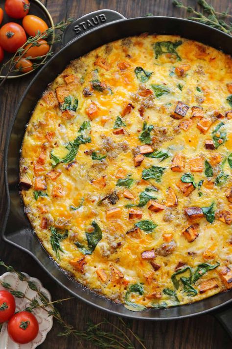 sweet potato frittata with sausage, spinach, cheddar, and pepper jack cheese - in a cast iron skillet. Fritata Recipe, Fritatta Recipe, Sausage Frittata, Sweet Potato Frittata, Potato Frittata, Easy Sweet Potato, Sausage Spinach, Breakfast Soup, Cubed Sweet Potatoes