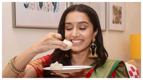 Actress Shraddha Kapoor spreads festive cheer on Instagram as she shares an adorable picture of herself with a modak, gearing up for the auspicious occasion of Ganesh Chaturthi. Her delightful post resonates with fans, exuding warmth and enthusiasm for the upcoming festivities. Grated Coconut, Cooking Together, Shraddha Kapoor, Ganesh Chaturthi, Shredded Coconut, The Mood, On Set, Spreads, Cute Pictures