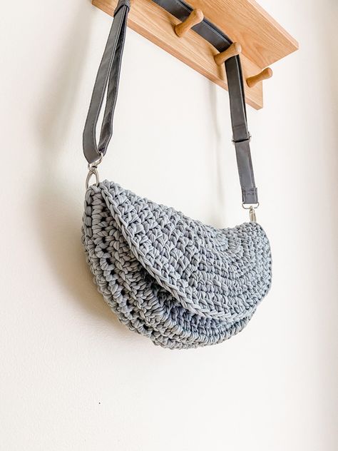 The crochet colorful motif Shoulder Bag is a beautiful and unique handmade bag perfect for anyone who feels special. This bag is made from crocheted organic paper yarn and has a unique design. very colorful It is a great gift for any occasion. 📍 PRODUCT DETAILS 📍 -Crochet. Knitted with paper yarn. -It is lined and has pockets. -Cannot be washed or dry cleaned. It can be wiped with a damp cloth. *Materials: Paper rope, lining fabric *Dimensions: 15.74 x 14.17 inches / 40 x 36 cm This hand-knitted bag is uniquely designed just for you. Each one is individually crafted with care, using high-quality yarns to create a one-of-a-kind design. Perfect for both everyday use and special occasions, this bag boasts a spacious interior that can hold all of your essentials. Its lightweight construction T Shirt Yarn Crochet Bag Pattern Free, Crochet Saddle Bag, Crossbody Crochet Bag, Crochet Clutch Pattern, Crochet Sling Bag, Crochet Crossbody Bag, American Crochet, Knit Items, Clutch Pattern