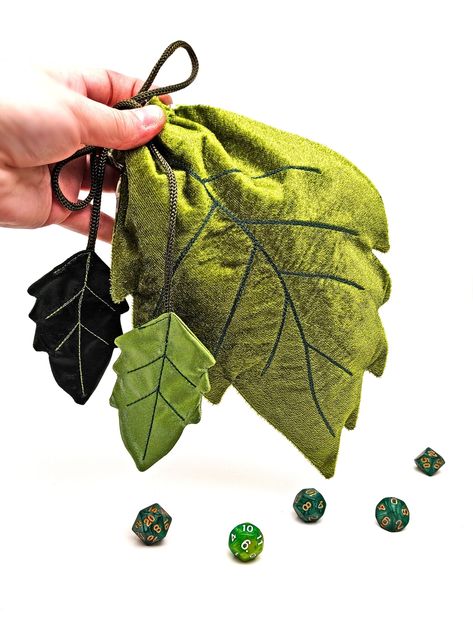 Excellent dice bag in the form of a leaf of a tree!     The dnd dice bag closes with a drawstring with a plastic clip.     Beads are installed at the ends of the cord.     Dice holder made of quality velvet fabric with cotton lining inside for safety.     The dice pouch is ideal for dice, treasures, jewelry and other small items. Also, the bag can be used to store a deck of tarot cards as well as runes.     Leaf dice bag dimensions: - Length - (10 inches or 25 cm) - Width - ( 7 inches or 18 cm) - Dice storage holds about 150 dice!    Dice bag care - gentle wash in water 30 - 40 degrees Celsius (slightly warm).     A bag for dice will be a great gift for a fan of DND games, as well as for witches, sorcerers and tarot readers :) Dnd Sewing Pattern, Leaf Pouch Pattern, Dnd Dice Bag Pattern, Leaf Bag Pattern, Dice Bag Pattern Sewing, Dice Bag Sewing Pattern, Diy Dice Bag, Dnd Dice Holder, Dice Bag Pattern