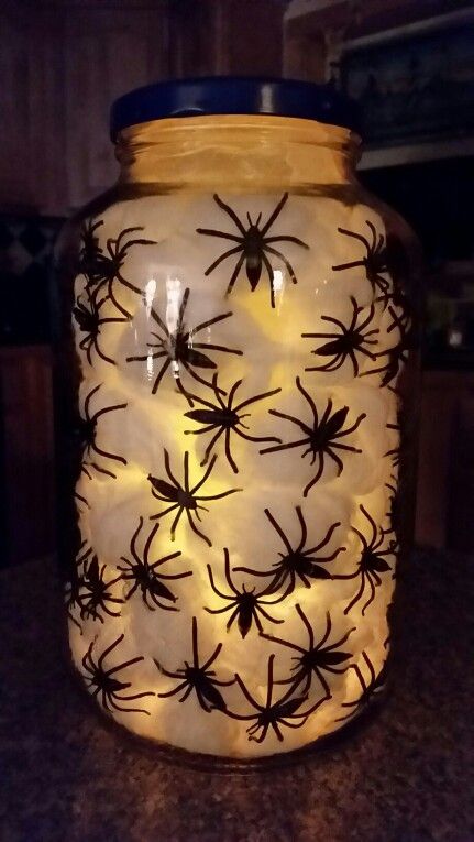 Halloween Jar Filler Ideas, Halloween Jars Creepy, Halloween Head In A Jar Diy, Cheese Ball Container Crafts, Halloween Glass Jars, Halloween Tip Jar, Empty Jars Ideas Diy, Decor Above Kitchen Cabinets, Mad Scientist Halloween