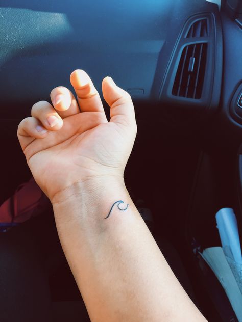 Wave tattoo to remind me of home.     #wave #tattoo #tattoos #ink #inked #wrist #wristtattoo #simple #simpletattoo #minimalistic #minimalistictattoo #beach #beachtattoo #wavetattoo #wrist Ride The Wave Tattoo Words, Tiny Wave Tattoo Wrist, Wrist Beach Tattoo, Wave Tattoo Simple Wrist, Wave On Wrist Tattoo, Small Wave Tattoo Wrist, Wrist Wave Tattoo, Wave Tattoo Wrist, Golf Tattoo