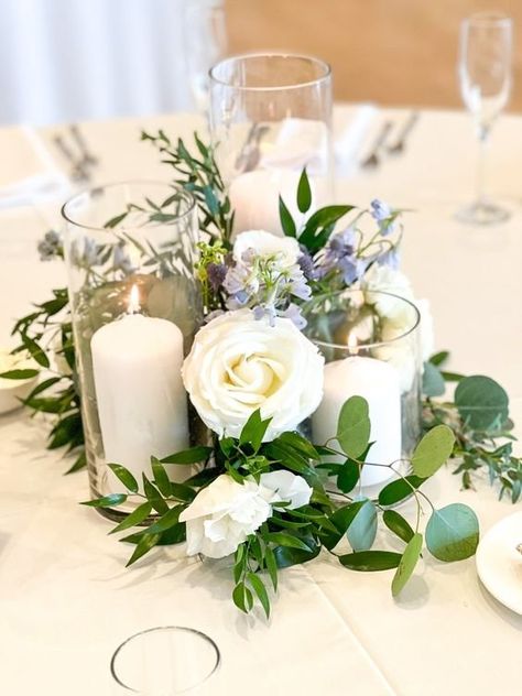 White And Blue Centerpieces Wedding, White And Blue Wedding Flowers Centerpieces, White And Blue Centerpieces, Candle Greenery Centerpiece, Rectangle Table Centerpieces Wedding, Candle Centerpieces Elegant, Round Table Centerpieces, Round Wedding Tables, Greenery Wedding Centerpieces