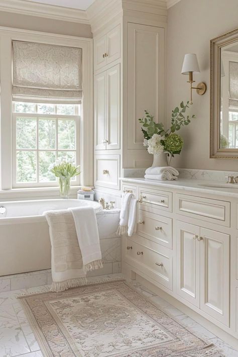 Cream And Marble Bathroom, White Bathroom Beige Tile, First Floor Bathroom Ideas, Elegant White Bathroom Ideas, Cream Cabinet Bathroom, French Style Master Bathrooms, Best Bathroom Countertops, Cream Cabinets Bathroom, Neutral Marble Bathroom