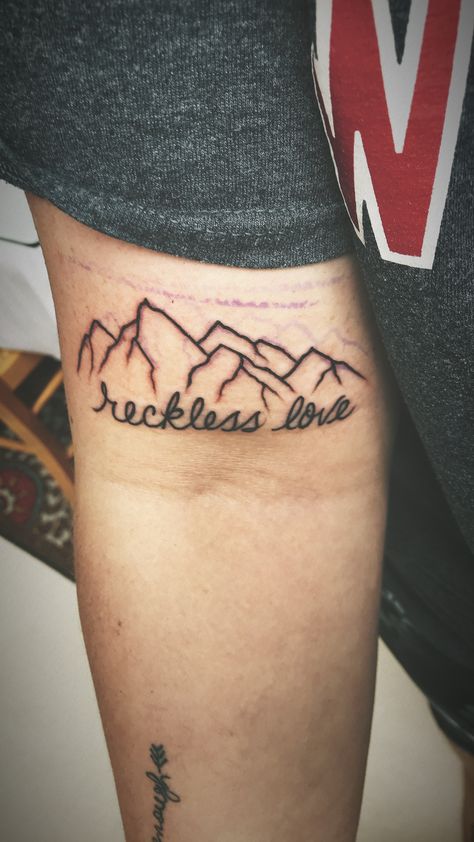 Reckless love tattoo Reckless Love Of God Tattoo, Reckless Love Tattoo, Reckless Tattoo, Arm Writing Tattoo, Godly Tattoos, Tattoo Word Fonts, Reckless Love, Good Tattoo Quotes, Faith Tattoo