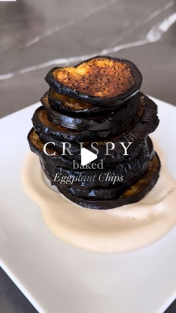 Sivan's Kitchen on Instagram‎: "‎‏Crispy baked eggplant chips that are so addicting🍆🍆🍆
‎‏You can serve them topped with tehina and fresh parsley on top or with just a squeeze of lemon too 🍋. 

‎‏Ingredients:
‎‏Eggplants 
‎‏Avocado oil spray or olive oil spray 
‎‏Salt 
‎‏Perfect tehini 
‎‏•1 cup of sesame tahini paste 
‎‏•3/4 cup of water 
‎‏•3 tbsp. Of lemon juice 
‎‏•1 tsp. Of salt 
‎‏•2 cloves of garlic 
‎‏Blend all together in a food processor or blender. 

‎‏Directions:
‎‏Preheat oven to 425° F. 
‎‏1. Wash and dry your eggplant 
‎‏2. Cut slices of about 1/2 inch thick 
‎‏3. Line a baking sheet with parchment paper 
‎‏4. Generously spray your paper 
‎‏5. Sprinkle salt 
‎‏6. Lat your slices flat 
‎‏7. Spray once again and sprinkle salt 
‎‏8. Bake for about 45 minutes. I like to flip Crispy Baked Eggplant, Sivan's Kitchen, Salad Beans, Eggplant Chips, Sesame Tahini, Keto Veggies, Greens Salad, Tahini Paste, Sprinkle Salt