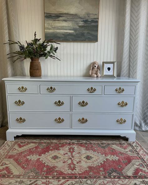 🌿AVAILABLE🌿 Vintage Drexel 7 Drawer Dresser newly refinished in the @sherwinwilliams color of the year, Upward. This is the softest most gorgeous blue color with a slight silver undertone. To me this one screams nursery or grandmillennial style. The details on the bottom of this dresser are beautiful and the original hardware was simply polished and kept intact with this beauty. The top three drawers have been lined with a simple grey and white wallpaper to add just a little extra pop. All ... Baby Blue Dresser Nursery, Blue Dresser Nursery, Dresser Nursery, Dresser In Living Room, Grey And White Wallpaper, Grandmillennial Style, Blue Dresser, 7 Drawer Dresser, Drawer Dresser