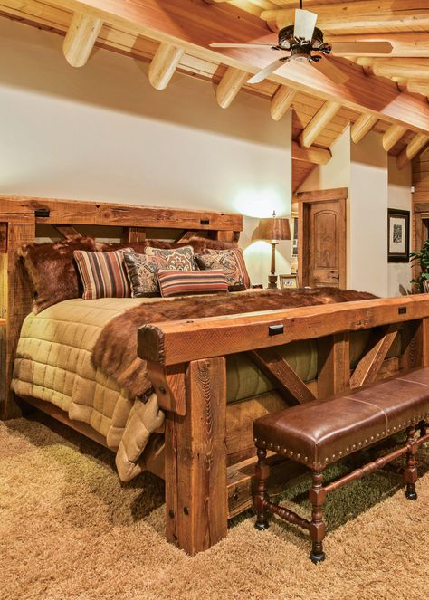 This master bedroom suite encompasses the entire second level of this California log home, which emphasizes an open, airy feeling everywhere. LED lights along the ridge beam add warmth, as does the intimate fireplace. Rustic Timber Bed, Diy Seng, Log Home Bedroom, Log Bedroom Furniture, Skjulte Rum, Log Bedroom, Kleiner Pool Design, Rustic Bed Frame, Rustic Bed