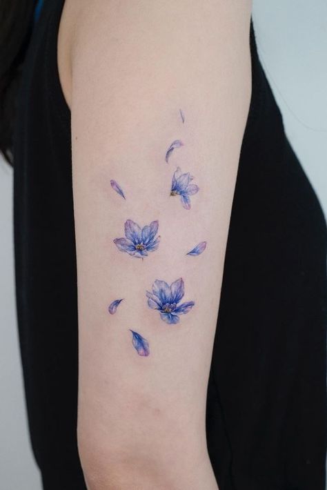 Flying Flowers Tattoo, Blue Daisy Tattoo, Small Blue Tattoo, Blue Flowers Tattoo, Dark Blue Tattoo, Blue Flower Tattoo, Blue Flower Tattoos, Flower Tattoo On Ribs, Lilac Tattoo