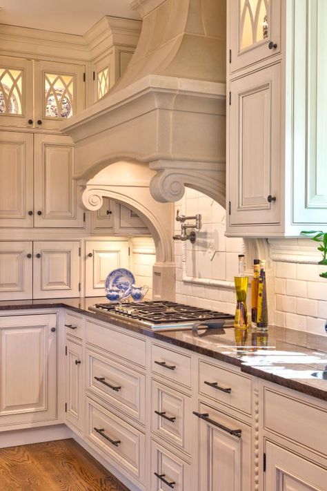 This dreamy traditional kitchen features floor-to-ceiling cabinets and a stately white stone range hood. Check it out only at HGTV.com. Instagram Minimalist, Kitchen Ikea, Kitchen Design Pictures, Custom Kitchens Design, Traditional Kitchen Design, Kitchen Range Hood, Kitchen Hoods, Classic Kitchen, Best Kitchen Designs