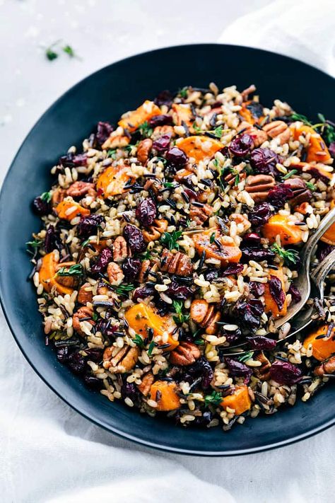 Cranberry Pecan Sweet Potato Wild Rice Pilaf is such an amazing side dish because it is infused with so many incredible flavors and textures. Crunchy pecans, cranberries, sweet potato, wild rice, and herbs come together in this unforgettable dish! Sweet Potato Wild Rice, Slowcooker Pasta, Wild Rice Pilaf, Wild Rice Recipes, Cheese Log, Cheese Potato, Cranberry Pistachio, Rice Side, Rice Side Dishes