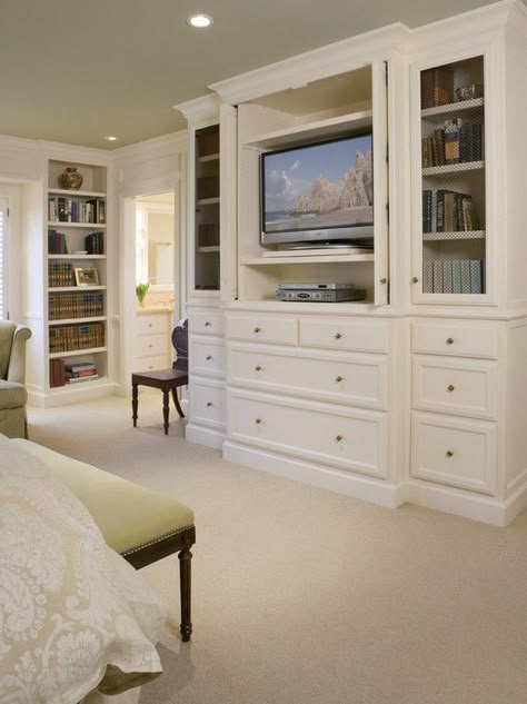 Love this idea. Built ins to hide the TV in the bedroom. Plus the shelving/storage for DVDs etc.  Nobody wants to see that stuff in their bedroom Hidden Tv Bedroom, Bedroom Upgrades, Built In Bookshelves, Traditional Bedroom Design, Bookcase Ideas, Bedroom Built Ins, Bedroom Organization, Wall Units, Tv In Bedroom