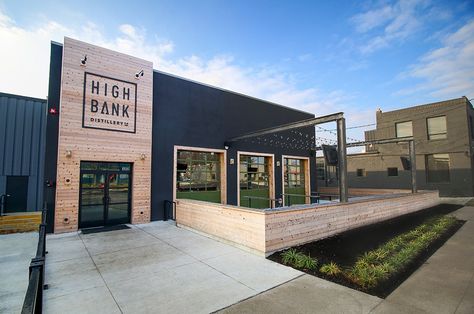 Entrance and patio space at High Bank Distillery Metal Building Renovation, Shop Landscaping Ideas, Rustic Commercial Building, Metal Building Office Design, Exterior Warehouse Design, Metal Commercial Buildings, Commercial Patio Design, Commercial Metal Building Exterior, Business Entrance Ideas