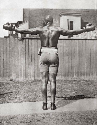 BOXING: Heavyweight Boxing Champion Jack Johnson Posing Outdoors Date Photographed: ca. 1915 | Total fights 104, Wins 73, Wins by KO 40, Losses 13, Draws 10.  Johnson had a huge reach and always looked taller than his actually 6' 1/2" Still a big man for the times. at the height of the Jim Crow era—became the first African American world heavyweight boxing champion (1908–1915). Jack Johnson Boxer, American Boxer, Critical Race Theory, Black Experience, Heavyweight Boxing, Boxing History, Walker Evans, Boxing Champions, Jack Johnson