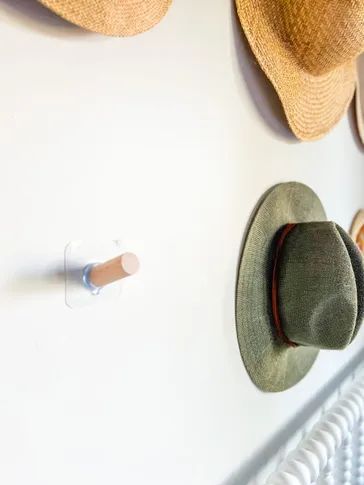 Adding hooks to our wall to complete the hat display. Hat Wall Hooks, Cowboy Hat Storage Ideas Diy, How To Display Hats On A Wall, How To Hang Cowboy Hats On Wall, Wall Hat Display, Hat Hook Ideas, Wall Of Hats, Cowboy Hat Wall Display, Wall Hat Display Ideas