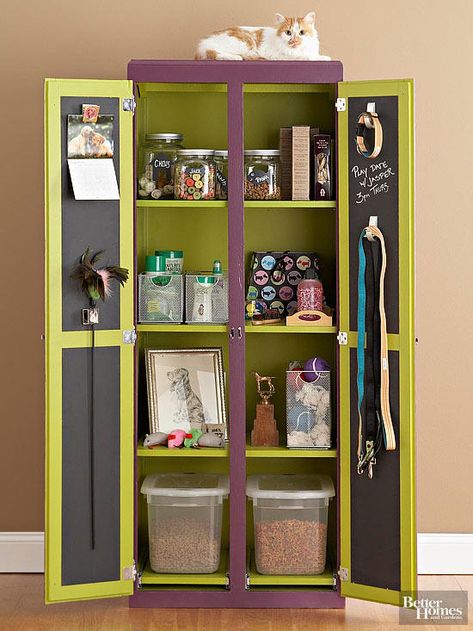 An armoire outfitted with shelves tames pet supplies, while the chalkboard inside the doors displays reminders for playdates and appointments. Spacious, divided compartments provide a manageable way to organize treats, toys, and grooming supplies; each one is tall enough to organize bins and boxes of all sizes. Dogs Hacks, Dogs Room, Pet Supplies Organization, Pet Station, Food Storage Cabinet, Dog Storage, Armoire Cabinet, Dog Organization, Pet Decor