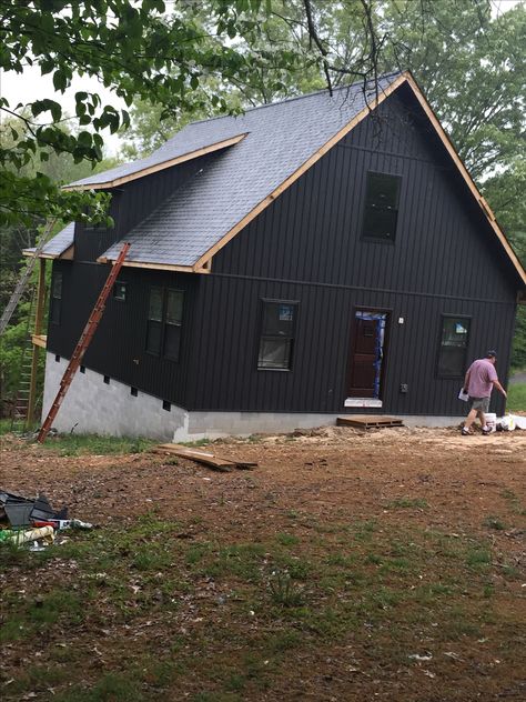 I loved this dark gray board and batten siding the moment I saw it. It really compliments the wooden door. Brick House Colors, Brick Farmhouse, Farmhouse Home Design, Exterior House Siding, Doors Wooden, Steel Framing, Stone Interior, Wooden Garage, Modern Farmhouse Home