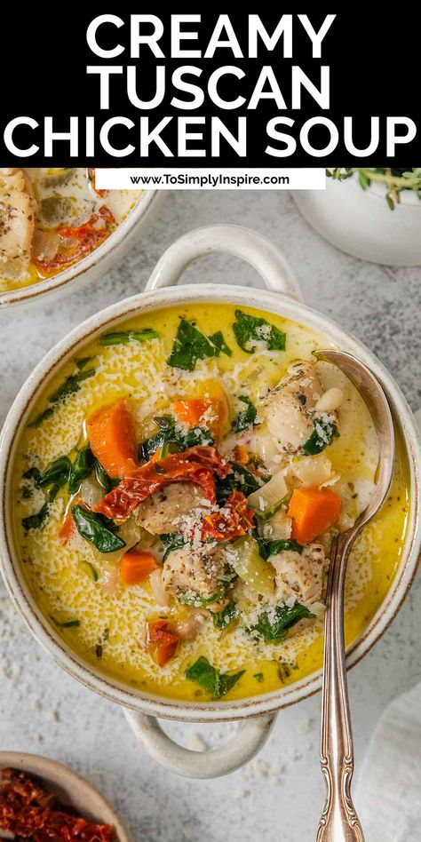 A bowl of easy creamy tuscan chicken soup with carrots, spinach and sun dried tomatoes and a spoon. Tuscan Chicken Soup Recipes, Tuscan Chicken Soup Crockpot, Tuscany Chicken Soup, Chicken Tuscan Soup, Creamy Tuscan Chicken Soup, Tuscan Chicken Stew, Tomato Chicken Soup, Tuscan Chicken Soup, Italian Chicken Soup