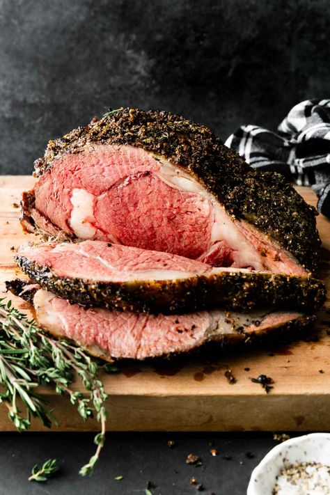 A simple, easy, stress-free recipe yielding rich & flavor-filled results every single time, my family's Foolproof Garlic Herb Crusted Prime Rib with Au Jus is the ultimate holiday meal! Standing rib roast is coated with loads of fresh rosemary, fresh thyme, & garlic, creating a perfect garlic herb crusted prime rib with classic flavor. Roasted briefly at high heat, then finished low & slow, this garlic herb prime rib reaches medium-rare with hardly any active prep involved. #primeribroastrecipe Christmas Roast Beef, Easy Roast Beef Recipe, Roast Beef Recipe, Prime Rib Roast Recipe, Easy Roast, Leftover Roast Beef, Slow Cooker Roast Beef, Christmas Roast, Sirloin Roast