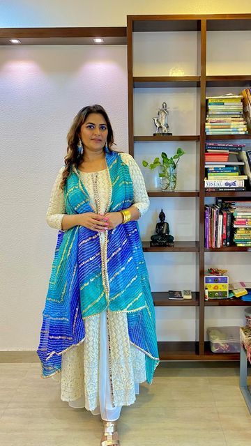 Kin Bathija on Instagram: "Let’s make this cape jacket in literally 10 mins from a dupatta 💙✨

Follow @costumetales for more tips and tricks on Fashion and Style ✨

#navratrispecial #navratrifestival #navratrioutfitideas #navratrioutfit #diyideas #costumetales #KinBathija #capejacket #capeshrug #dupattastyle" Dupatta Draping, Dupatta Style, Navratri Festival, Stitching Ideas, Cape Jacket, Navratri Special, Fashion Designing, Fashion And Style, Family Activities