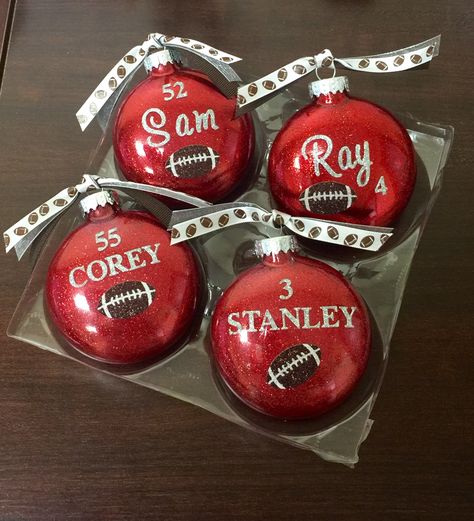 Handmade football ornaments given to players at banquet. Football Team Ornaments Diy, Football Banquet Gifts, Football Christmas Ornaments Diy, Diy Football Ornaments Ideas, Football Diy Gifts, Diy Football Ornaments, Football Ornaments Diy, Football Banquet Gifts For Players, Diy Football Gifts