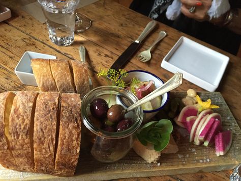 Bread, olives, and other pre-dinner nibbles served at The Lost Kitchen in Freedom, Maine, in 2016. Nibble Board, The Lost Kitchen, Lost Kitchen, Dinner Club, Clam Chowder, French Restaurants, Phone Calls, Top Chef, French Food