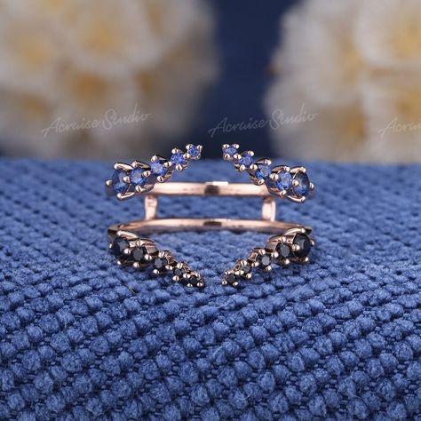 Vintage Sapphire Open Wedding Band Rose Gold Unique Black Blue Sapphire Ring Enhancer Matching Stacking Ring Art Deco Anniversary Gift Jewelry Information: ♡ A handmade, high-quality item ♡ Material: SOLID 14K/18K GOLD ( can be made in yellow/white/rose gold ) ♡ Stones: Blue & Black sapphire ♡ Cut - Round Shaped ♡ Band Width: Around 5mm Visit my shop for more jewelry: https://www.etsy.com/shop/acraisejewelry PRODUCTION We are jewelry artisans and manufacturers. Every Jewelry is made from the very scratch, and made by hand and carefully polished especially for you. PAYMENT PLAN We provide Payment plan. Click on the link to find out how it works: www.etsy.com/acraisejewelry/listing/1192465010/payment-plan SHIPPING It usually takes 2-3 weeks to make and 3-7 days to ship. FREE SHIPPING within Sapphire Ring Enhancer, Oval Ring Enhancer Wedding Bands, Oval Wedding Band, Vine Wedding Ring, Blue Sapphire Wedding Band, Open Wedding Band, Enhancer Wedding Band, Saphir Ring, Ring Enhancer